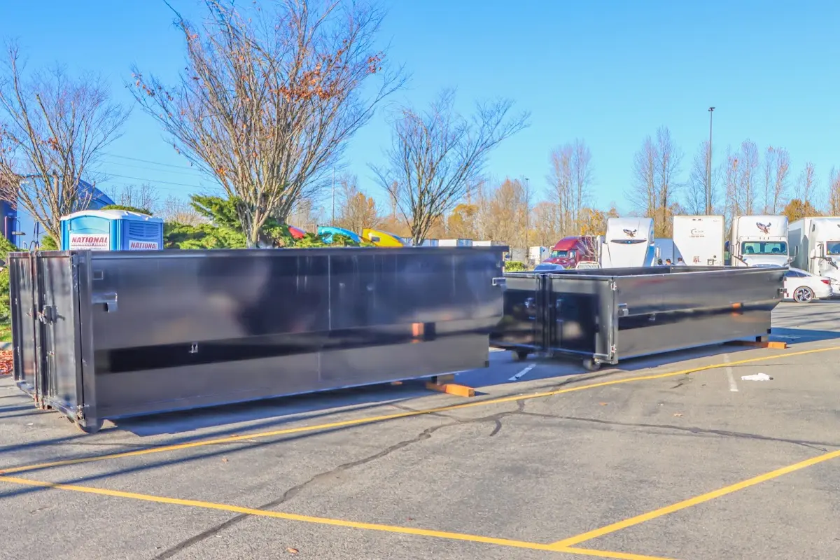 Professional dumpster rental service with roll-off container on residential driveway in Warr Acres